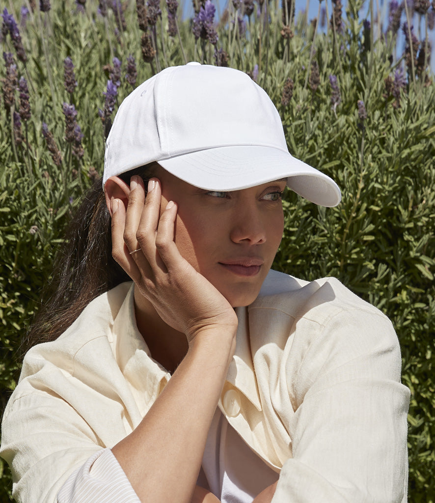 Female model in a plain white workwear cap suitable for business branding.